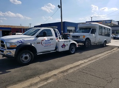 shuttle bus being towed